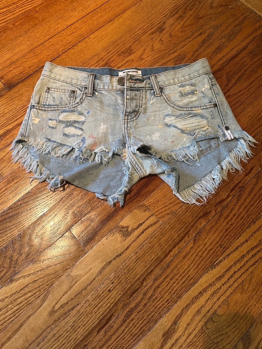 One x Oneteaspoon Women’s Light Blue Distressed Denim Shorts with Paint Accents